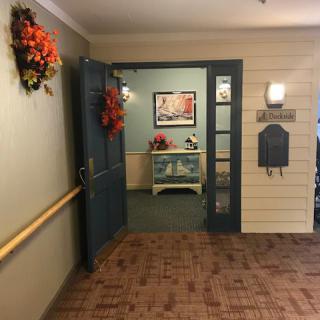 An inviting entryway decorated with festive wreaths and a cozy interior.