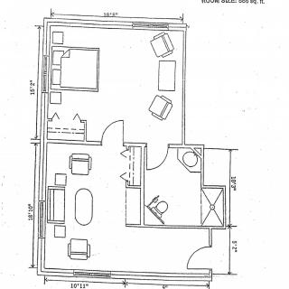 A floor plan depicting the layout of a small apartment, including a bedroom, living area, kitchen, and bathroom.