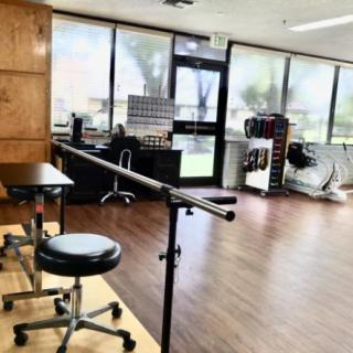 A bright and spacious rehabilitation therapy room equipped with exercise equipment.