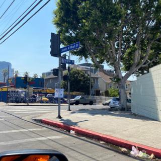 A bustling urban intersection on a sunny day.