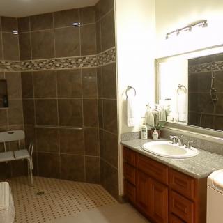 A modern bathroom with a spacious shower area and sleek design.