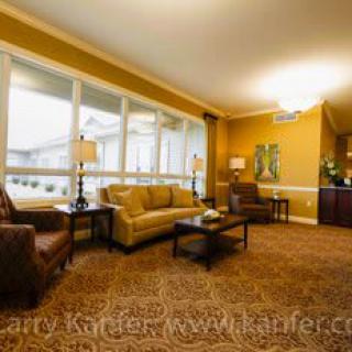 A cozy living room with comfortable seating and warm lighting.