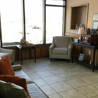 A cozy waiting room with comfortable seating and natural light.