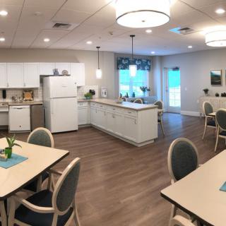 A modern kitchen and dining area with contemporary furnishings and lighting.