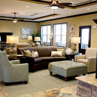 A well-decorated living room featuring modern furniture and warm lighting.