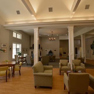 A spacious and well-lit lobby with comfortable seating and elegant interior design.