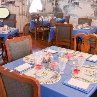 A cozy restaurant dining area with tables set for guests.