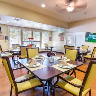 A cozy dining area featuring modern furnishings and ample natural light.