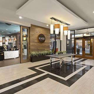 A modern lobby area featuring stylish decor, contemporary lighting, and a welcoming entrance.