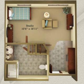A studio apartment floor plan showing the arrangement of furniture and layout of the room.