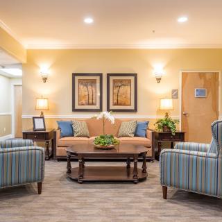 A cozy and well-decorated living room with comfortable seating and tasteful decor.