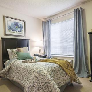 A cozy bedroom with elegant decor and soft lighting.