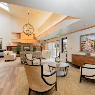 A beautifully designed modern living room featuring elegant furniture and ample natural light.