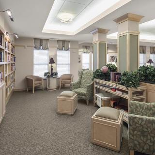 A cozy library interior with bookshelves, comfortable seating, and warm lighting.