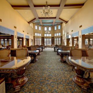 A luxurious lobby with elegant seating and a grand chandelier.