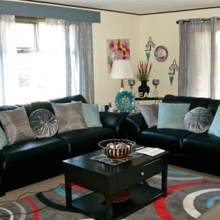 A modern living room with comfortable seating and stylish decor.