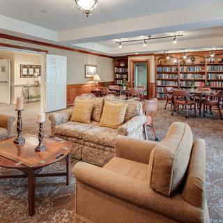 A cozy library with comfortable seating and bookshelves.