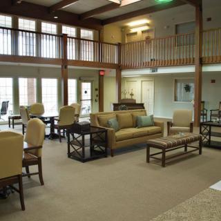 A spacious and modern lobby with comfortable seating arrangements and elegant interior design.