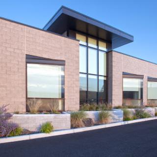 A modern commercial building with large windows and contemporary design.