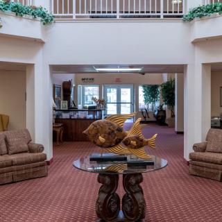 A spacious lobby interior with comfortable sofas and decorative elements.