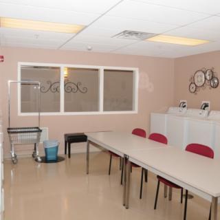 A conference room with tables and chairs arranged for a meeting.