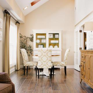 A cozy dining area featuring elegant chairs, a stylish table, and bright natural light.