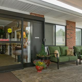 Welcoming entrance of a hotel featuring a cozy seating area.