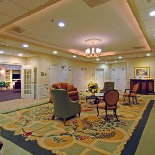 A well-decorated lobby area with comfortable seating and elegant lighting.
