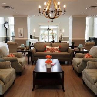 A cozy living room with comfortable seating and elegant decor.