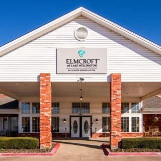 A healthcare facility building entrance with a sign reading 'Elm Croft'.
