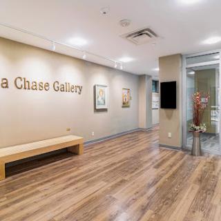 A view of the lobby area in the Chase Gallery, featuring modern decor and artworks.