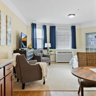 A cozy living room with modern decor and ample natural light.
