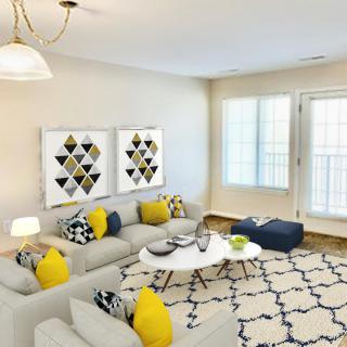 A modern living room with a gray sofa, yellow accent pillows, and geometric artwork.