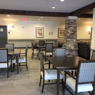 Indoor dining area with neatly arranged tables and chairs.