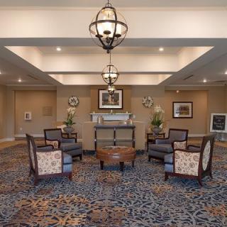 A stylish lobby with comfortable seating and elegant chandeliers.