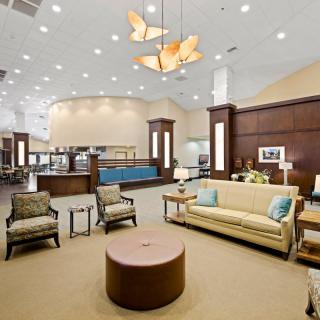 A spacious and modern lobby with comfortable seating and elegant lighting.