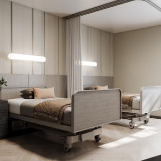 A modern hospital patient room featuring two beds and a calming color palette.