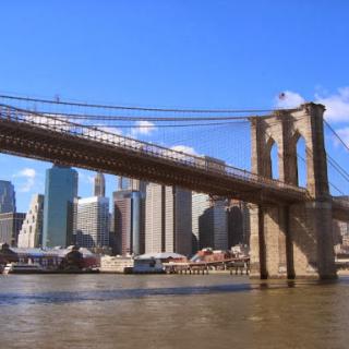 A stunning view of the Brooklyn Bridge with the New York City skyline in the background.