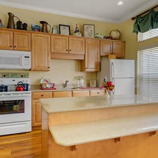 A cozy kitchen with wooden cabinets and modern appliances.