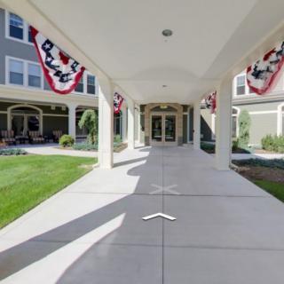 A building entrance decorated with red, white, and blue banners.