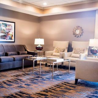 A cozy and modern living room featuring comfortable seating and stylish decor.