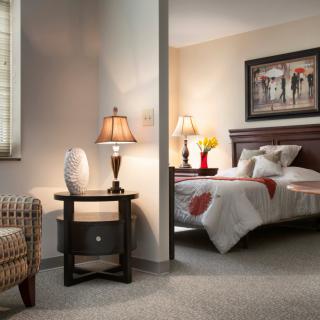 A cozy bedroom with warm lighting and elegant decor.
