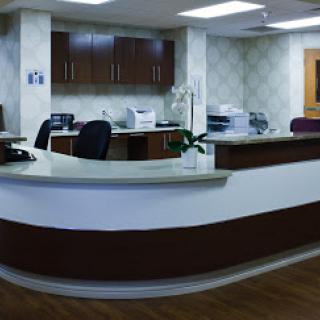 A modern reception area in a medical office, featuring sleek furniture and a welcoming atmosphere.