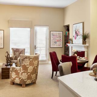 A modern living room with stylish furniture and colorful decor.