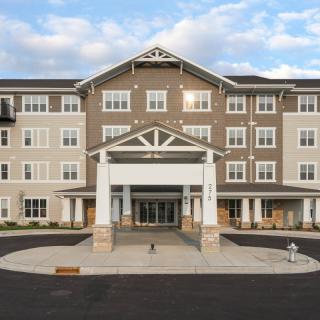 Front view of a modern residential building with a welcoming entrance.