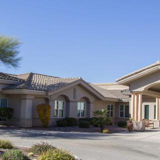 A suburban residential house with a well-maintained exterior and landscaping.