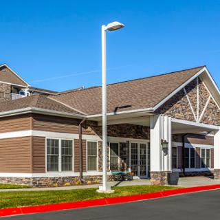 A modern residential building showcasing an inviting entrance and well-maintained exterior.