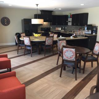 A modern kitchen and dining area with an open layout and stylish furniture.