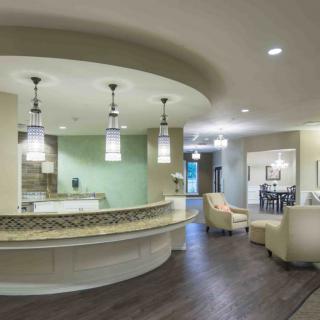 A modern reception area with elegant lighting and comfortable seating.