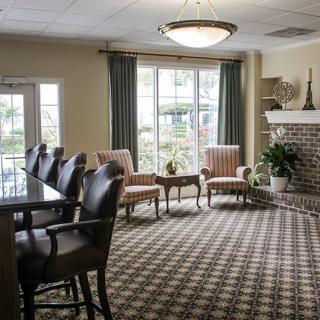 A cozy living room with comfortable seating and a fireplace.